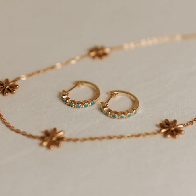 Pair of gold-tone Gaby hoops set with turquoise stones