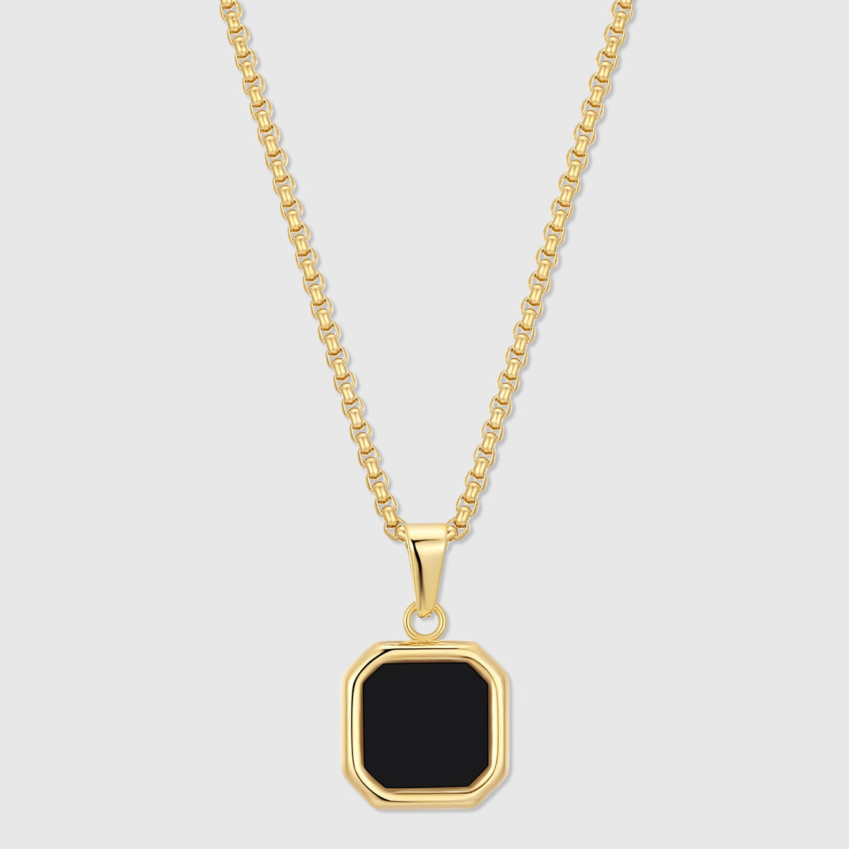 Gold-tone chain necklace with black octagon onyx pendant in a bezel setting