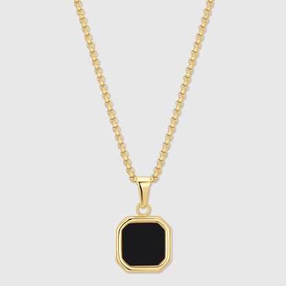 Gold-tone chain necklace with black octagon onyx pendant in a bezel setting