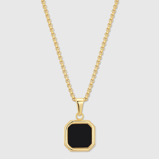 Gold-tone chain necklace with black octagon onyx pendant in a bezel setting