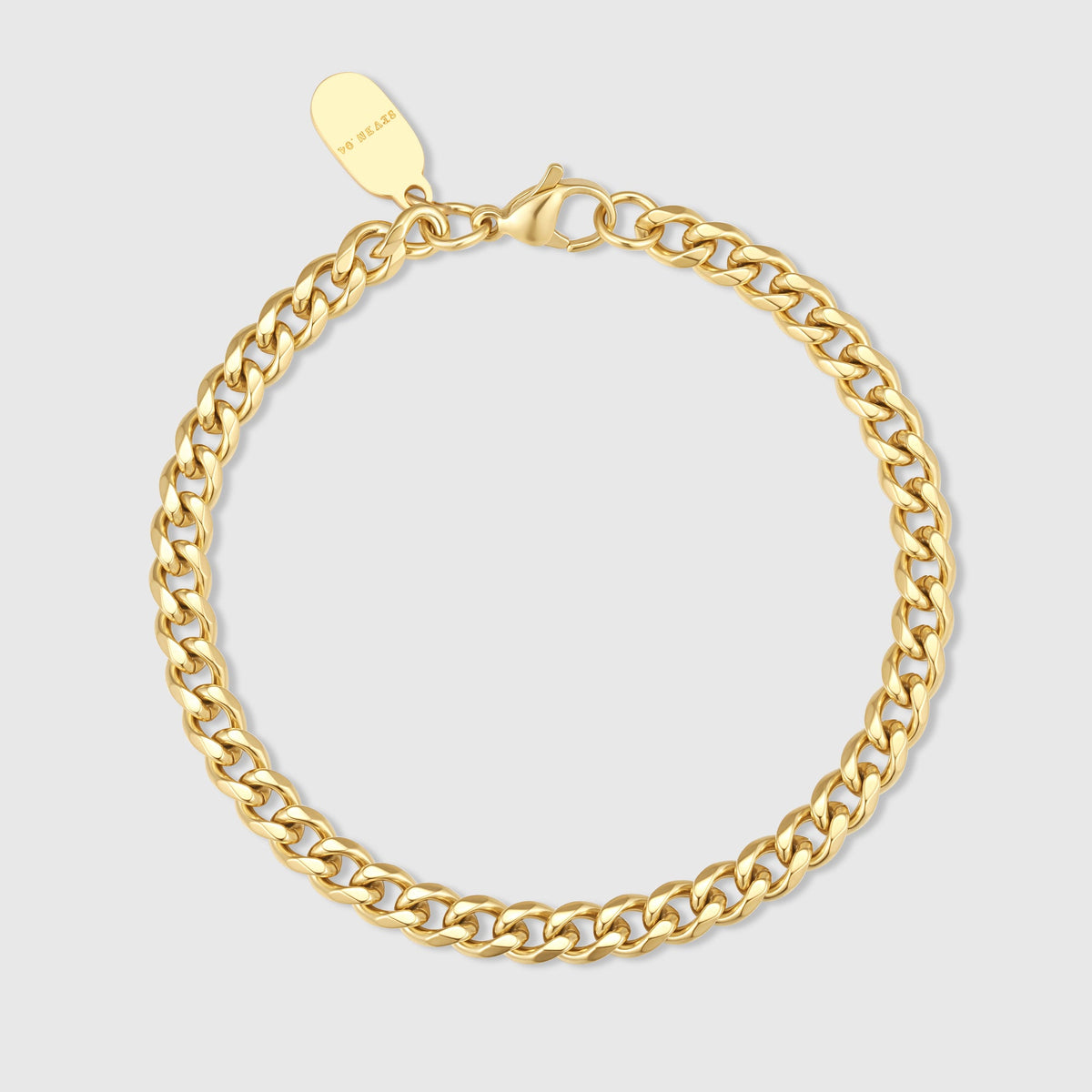 Gold Cuban link chain bracelet with oval clasp extender