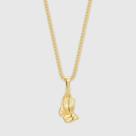 Gold praying hands pendant necklace on curb chain, pendant close-up