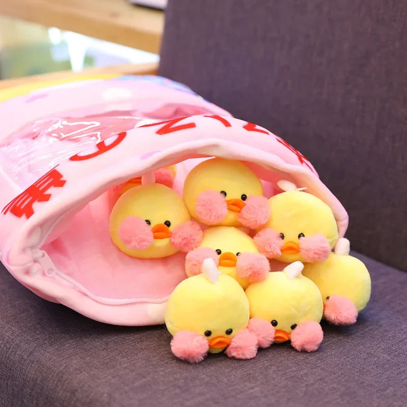 Pink plush pillow with duck graphic and small yellow duck plushies inside