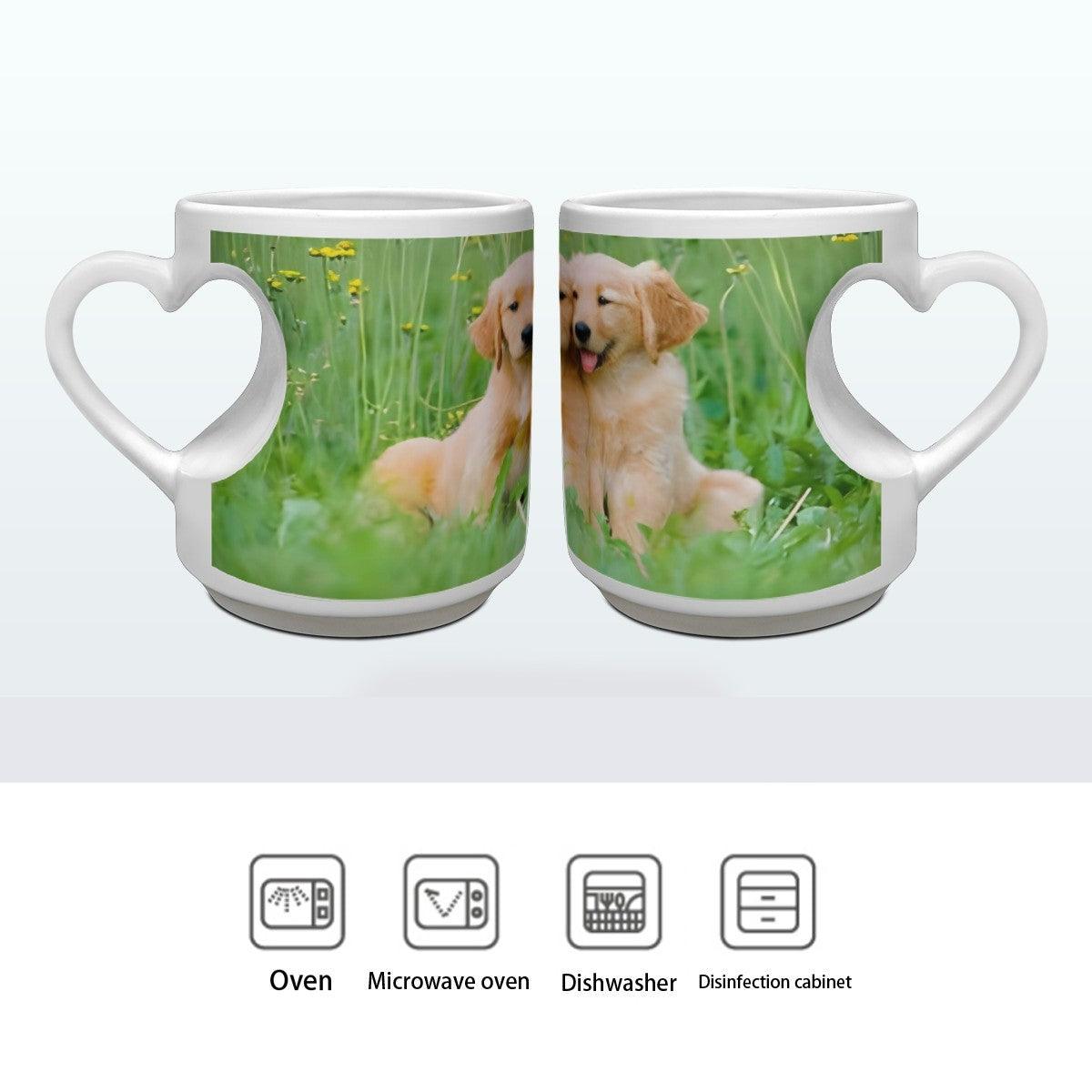 Two white ceramic mugs with heart handles, each with custom photo print of a golden puppy