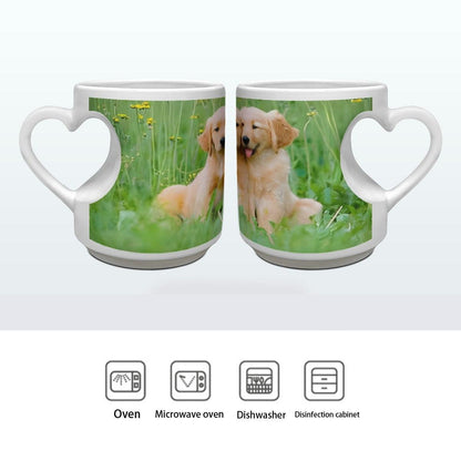 Two white ceramic mugs with heart handles, each with custom photo print of a golden puppy
