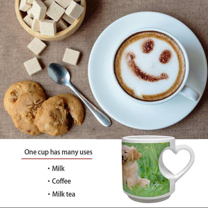 White ceramic mug with heart handle and golden puppy photo print on a coffee table