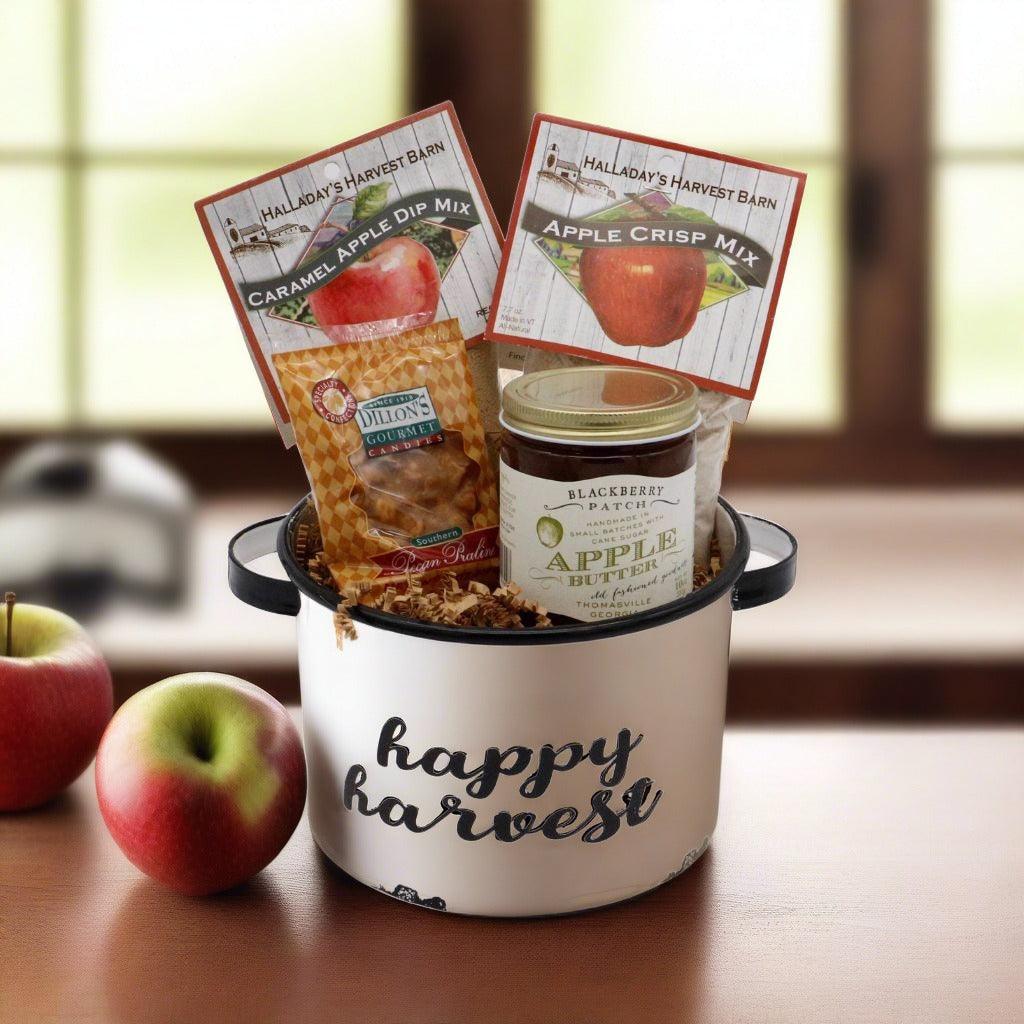 Happy harvest gift basket with apple dip packets and blackberry jam jar in enamel pail