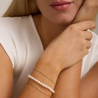 Gold paperclip chain bracelet with adjustable fit and small clasp detail