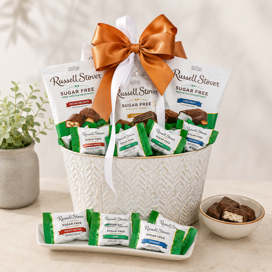 Sugar-free chocolate gift basket in white textured container with green bars and orange bow.