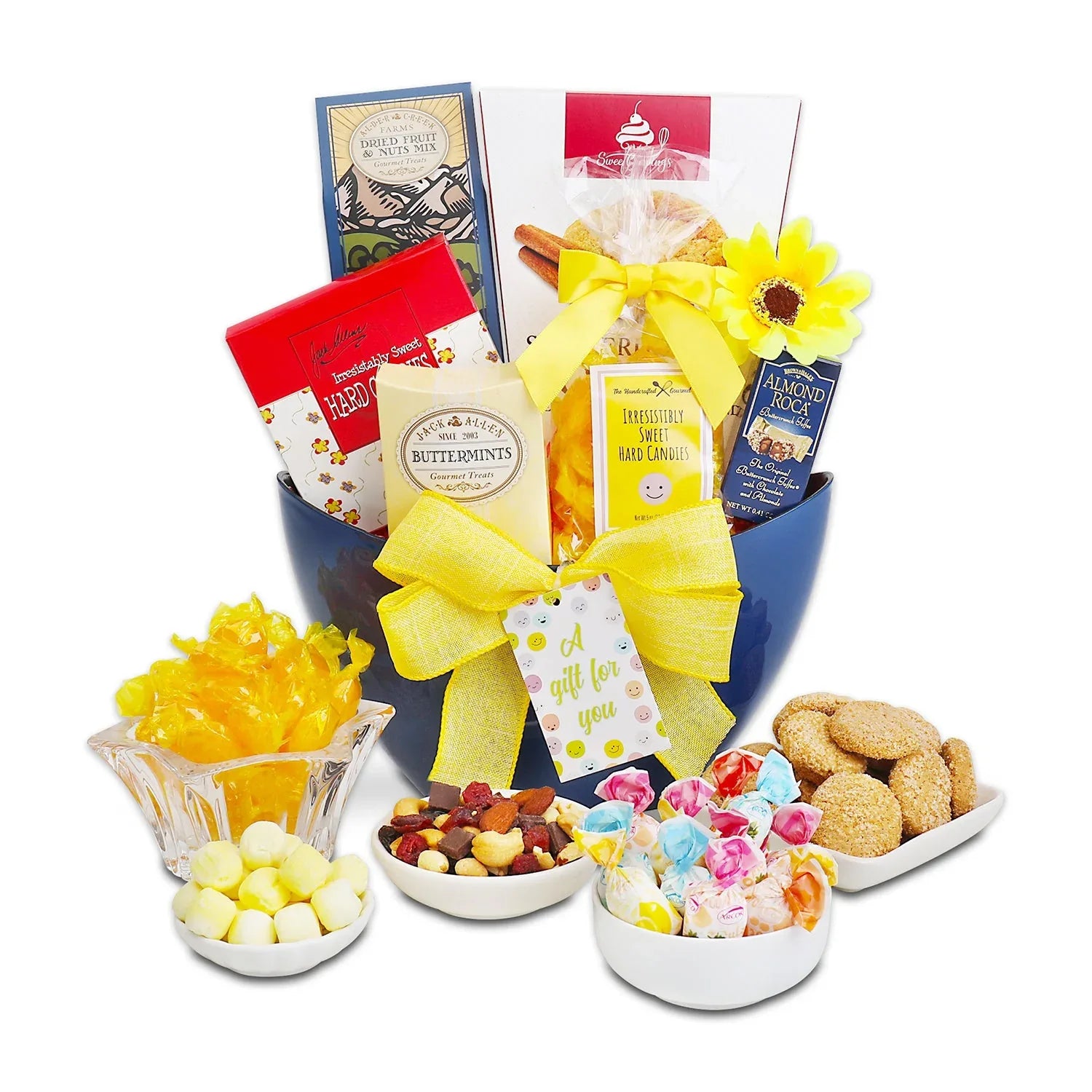 Gift tote with yellow bow and candy boxes, bowls of sweets on front