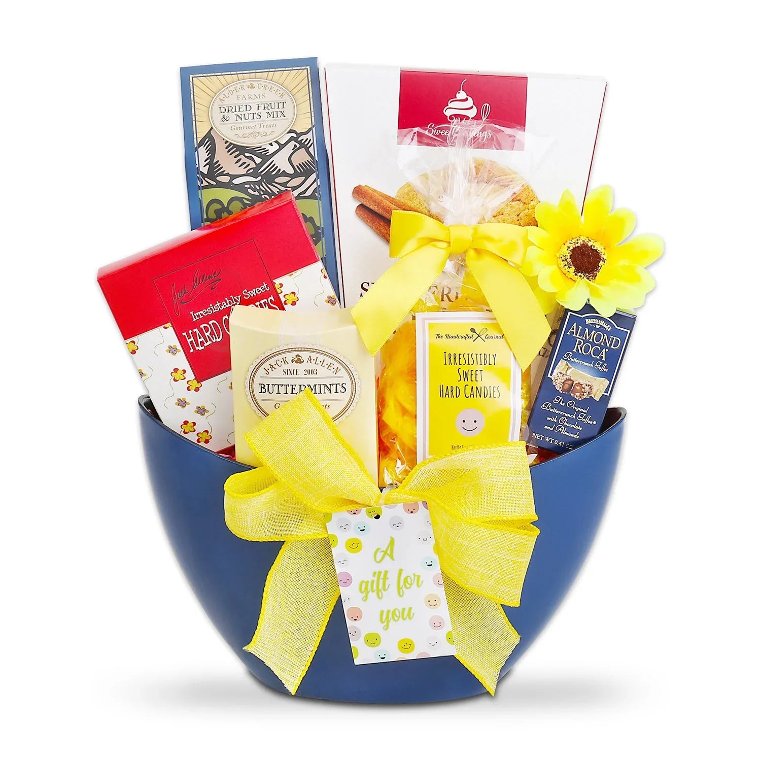 Blue gift tote with yellow ribbon bow and stacked wrapped sweet gift items