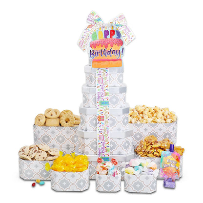 Happy Birthday treat tower gift with stacked boxes, big bow, and candle-shaped topper
