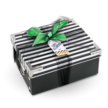 Striped black-and-white Halloween gift basket with green bow and ribbon tie