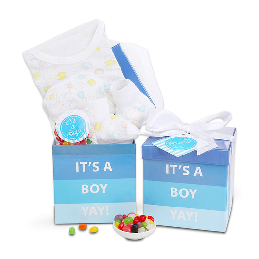 New baby gift basket with blue 'It's a Boy' boxes, baby onesie, and ribbon tag