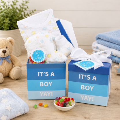 New baby gift basket with blue 'It's a Boy' box, onesie, and candy dish