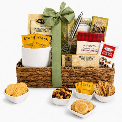 Gift basket with woven tray and green bow, soup packets, biscotti and snack pouches, cookie cups
