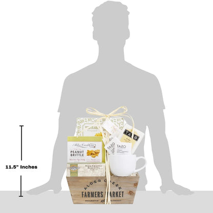 Tea gift basket in tote crate with mug and tea packets, shown on silhouette