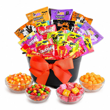 Halloween treat gift basket in black cauldron with orange bow, assorted candy bags
