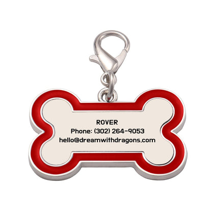 Red bone-shaped dog tag keychain with metal ring and printed contact details