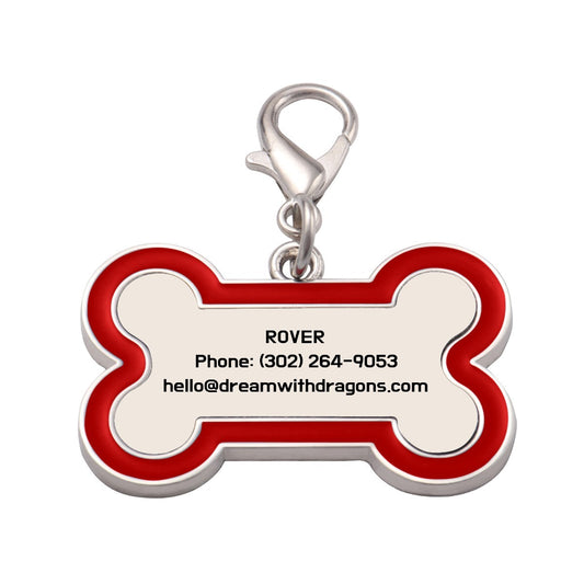 Red bone-shaped dog tag keychain with metal ring and printed contact details