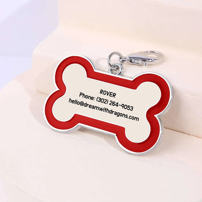 Red and silver bone-shaped dog tag keychain with lobster clasp and contact text