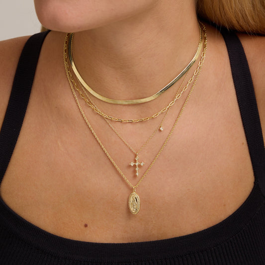Gold rope-chain necklace with oval Virgin Mary medallion pendant