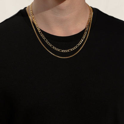 Layered gold-tone Figaro chain necklaces with oval links