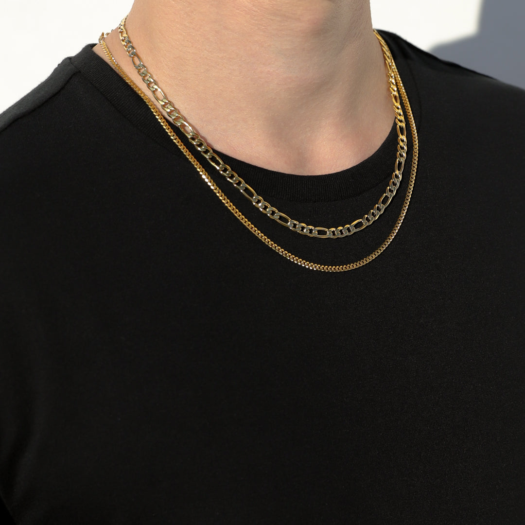 Layered gold-tone Figaro chain necklaces, oval link detail