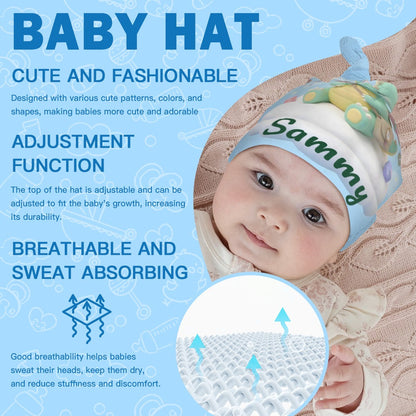Baby wearing green dragon hat with 'Sammy' and matching swaddle blanket fabric.