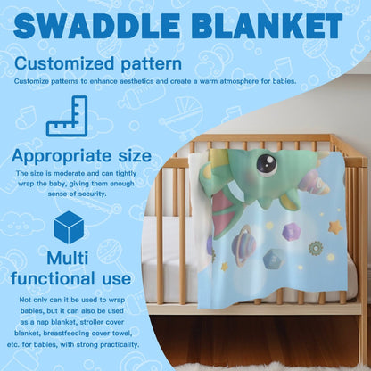 Green dragon swaddle blanket with matching hat shown in baby crib.