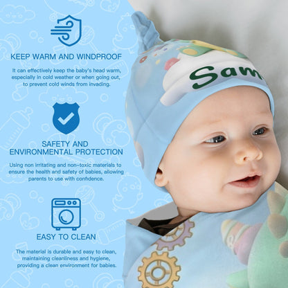 Baby wrapped in green dragon swaddle blanket with matching 'Sammy' hat.