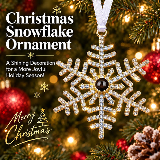 Gold-tone rhinestone snowflake ornament with hanging ribbon and dark photo-style center medallion
