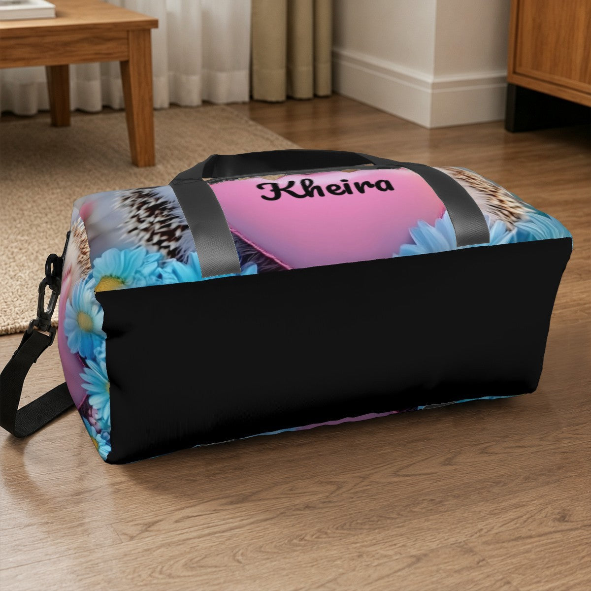 Hedgehog print duffel bag with black end panel and colorful blue accents