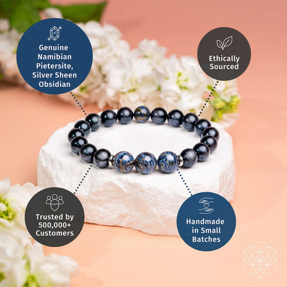 Dark beaded bracelet with three blue pietersite-style accent stones on a rounded strand