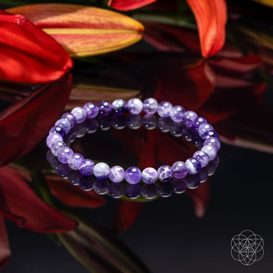 6mm amethyst beaded bracelet, round purple stones with subtle chevron pattern.