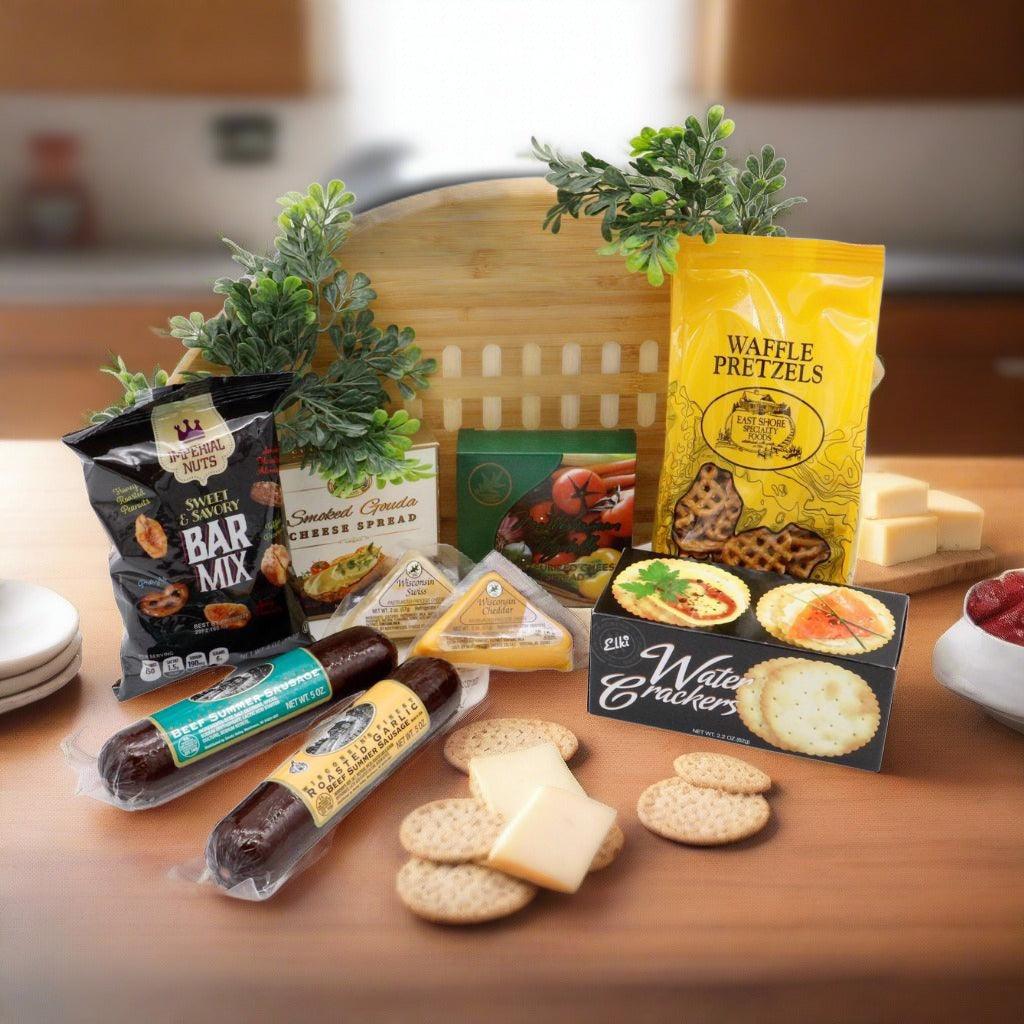 Football-shaped wooden cutting board gift set with snack bags, cheese, and crackers
