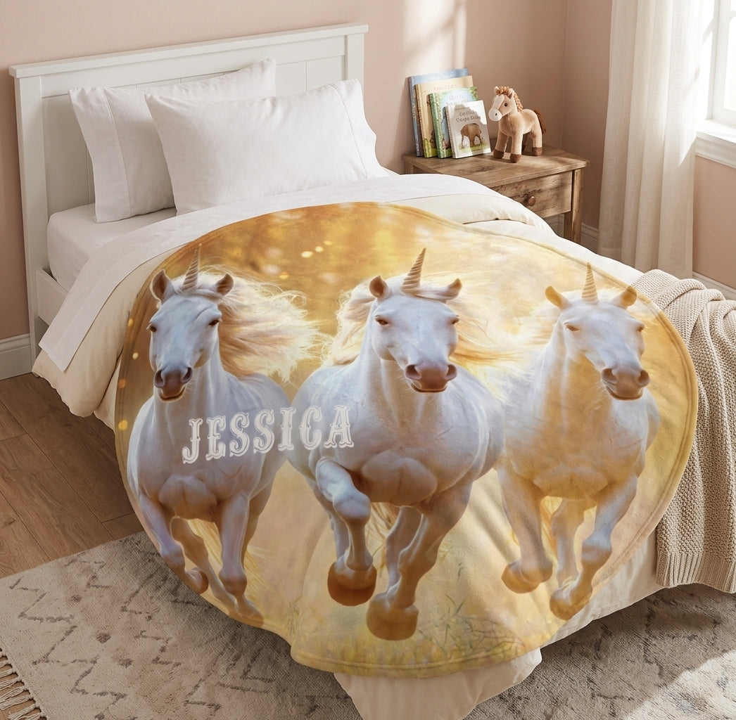 Round unicorn blanket with three white unicorns and name Jessica on golden beige
