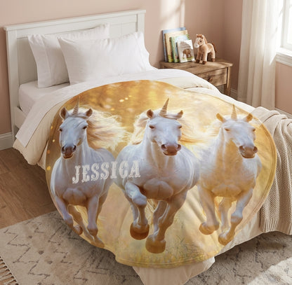Round unicorn blanket with three white unicorns and name Jessica on golden beige