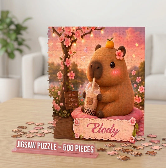 500-piece jigsaw puzzle with a capybara holding a cup on pink blossoms, name Elody