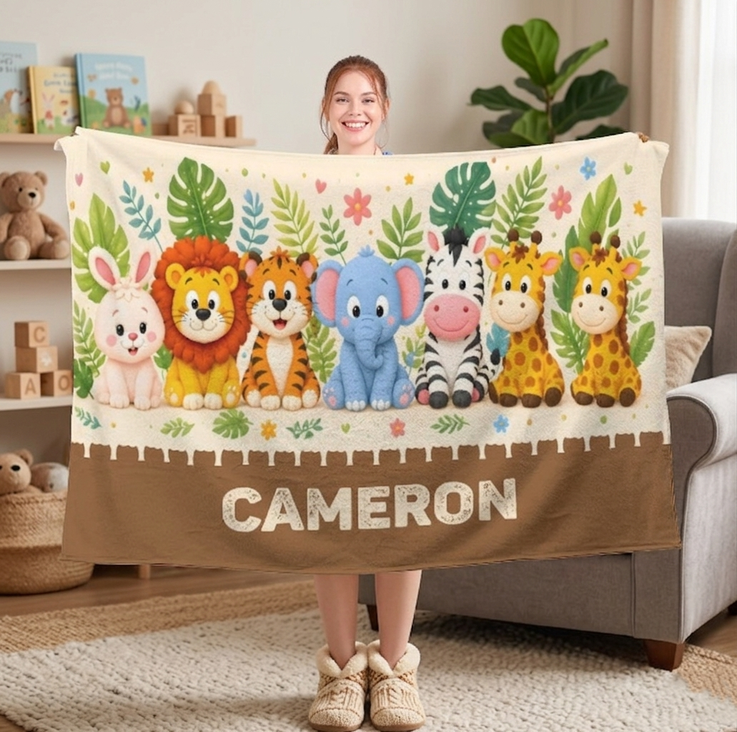 Personalized safari name blanket with jungle animal row and CAMERON text, cream panel and brown hem