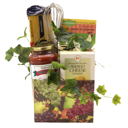 Italian gourmet gift basket with pasta, cheese straws, sauce jar, and grape leaves