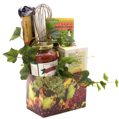 Italian gourmet gift basket with pasta, cheese straws, sauce jar, and grape-leaf wrap
