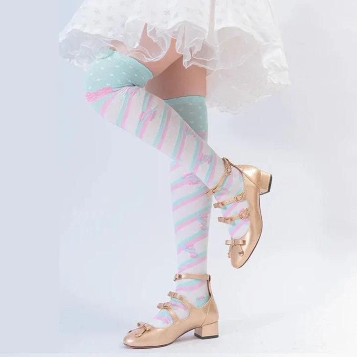 Knee-high socks with pastel rainbow stripes and light heart print
