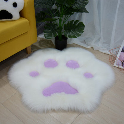 White faux fur round cat paw area rug with purple paw pad details