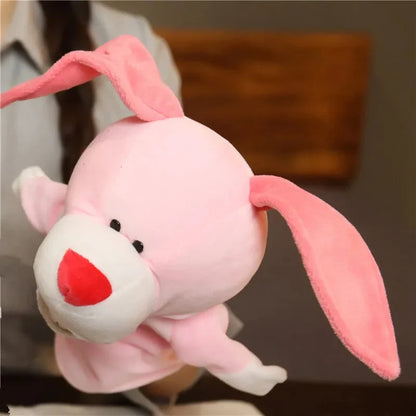 Pink plush finger puppet rabbit with floppy ears and red nose