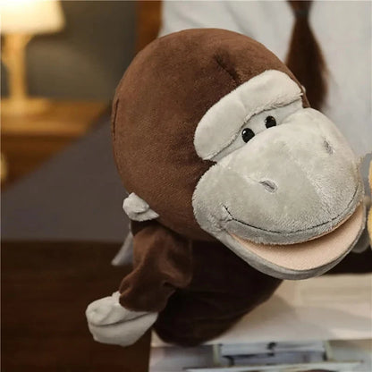 Stuffed animal finger puppet with brown body and white muzzle, plush face close-up
