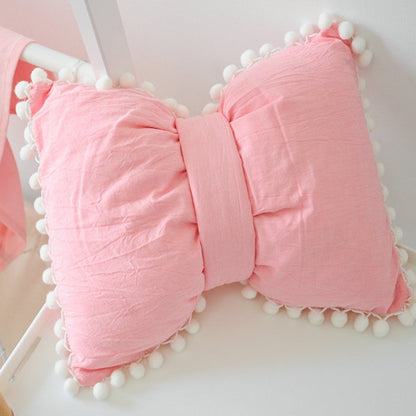 Light pink bow decorative pillows with pom pom trim, two-piece set