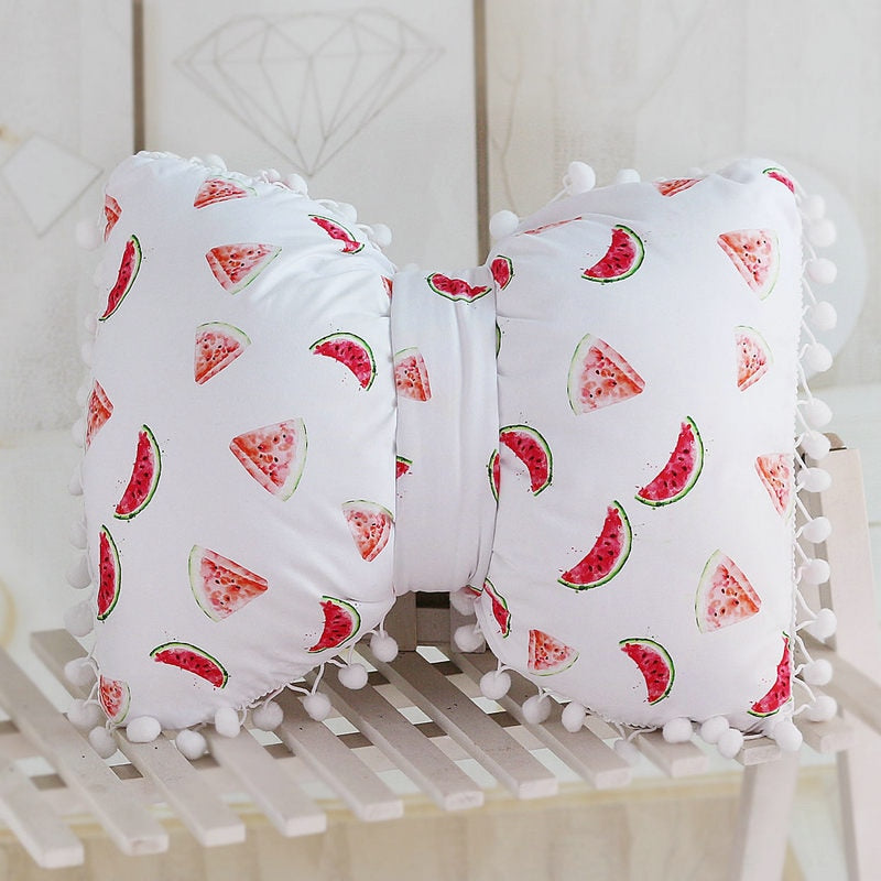 White bow decorative pillows with watermelon print and pom pom trim, two-piece set