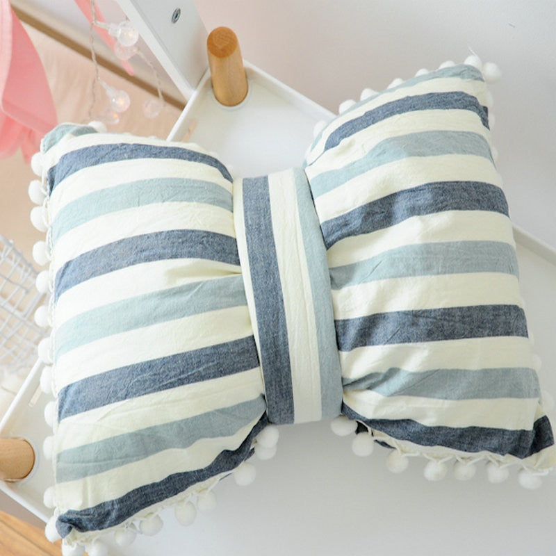 Blue and white striped bow decorative pillows with pom pom trim, set of two