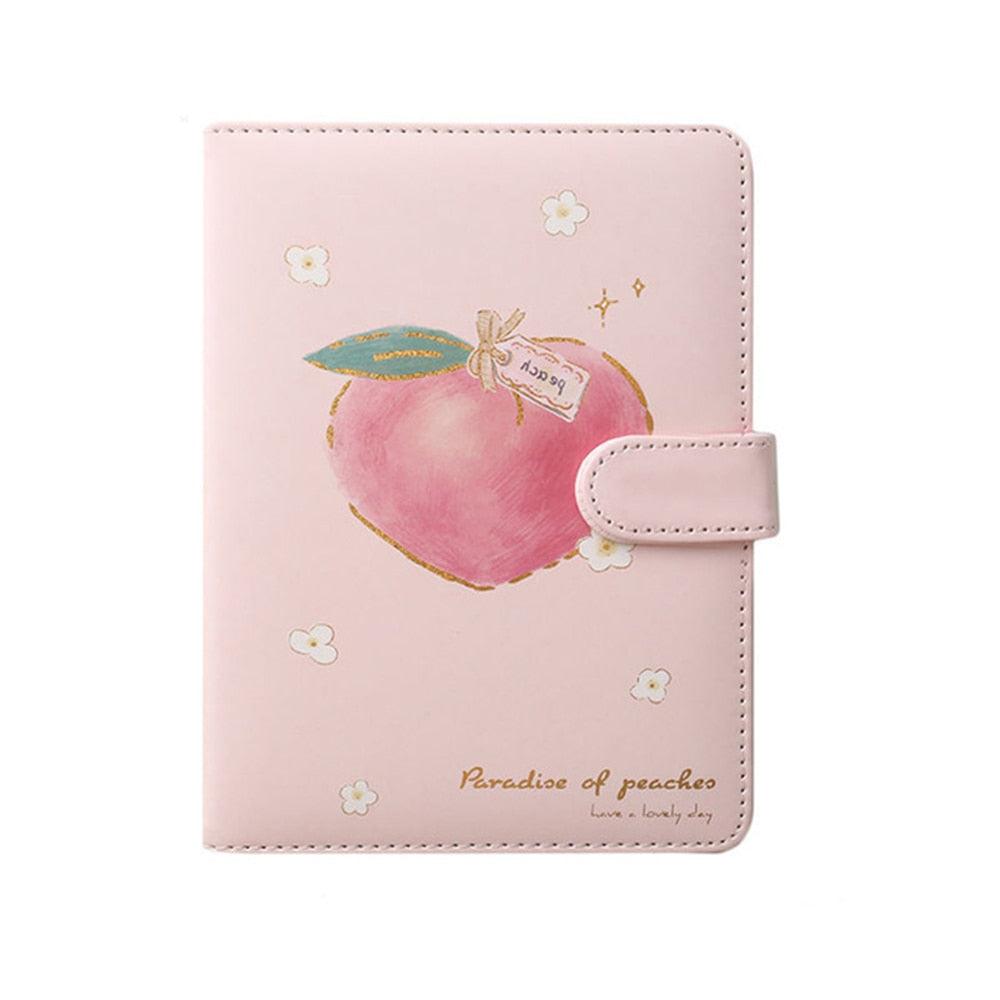 Pink peach notebook with side strap, stitched edges, flower icons, and a peach illustration